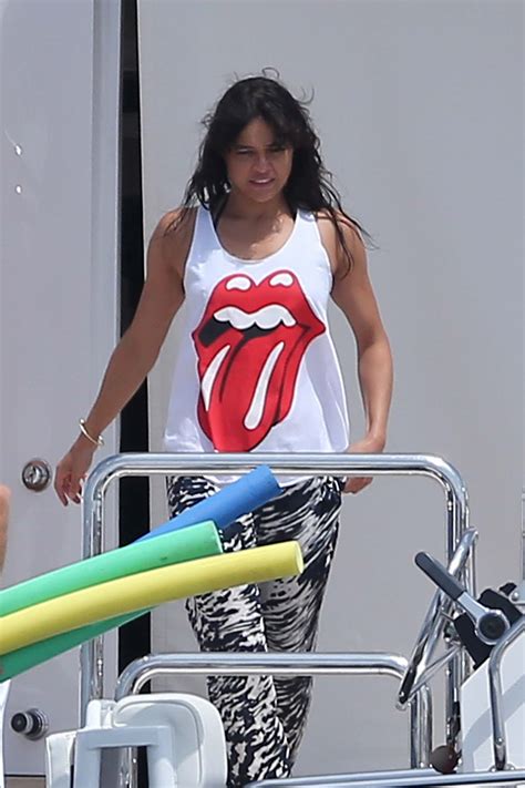 Michelle Rodriguez rocks a tiny white bikini with a mystery blonde ...